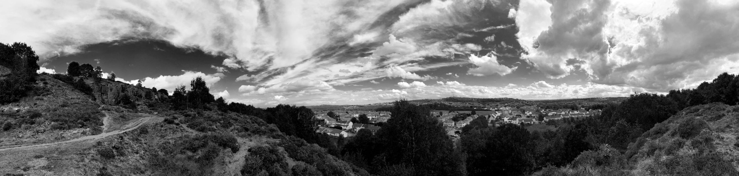 Cliff Walk with Bright Blue Sky & Sculpted Clouds